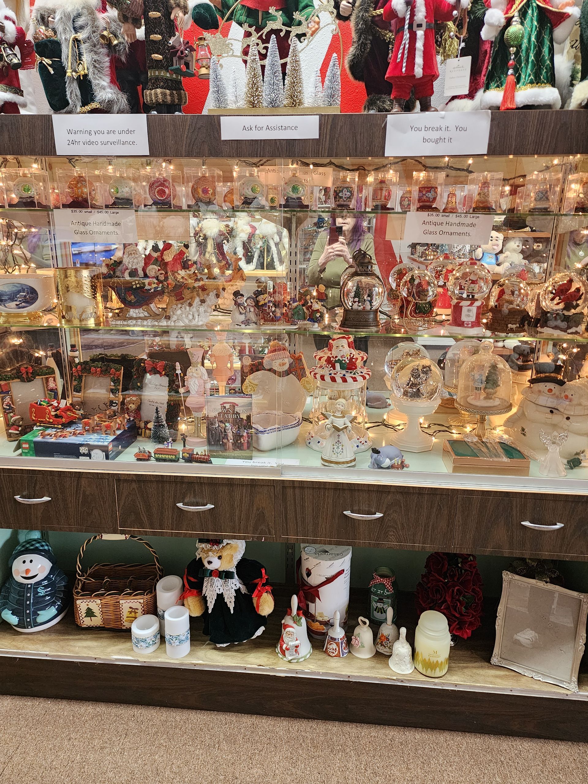A display case filled with lots of christmas decorations