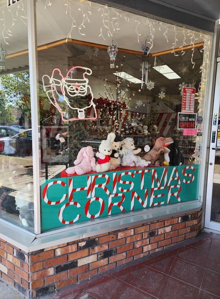 A christmas corner is displayed in a store window
