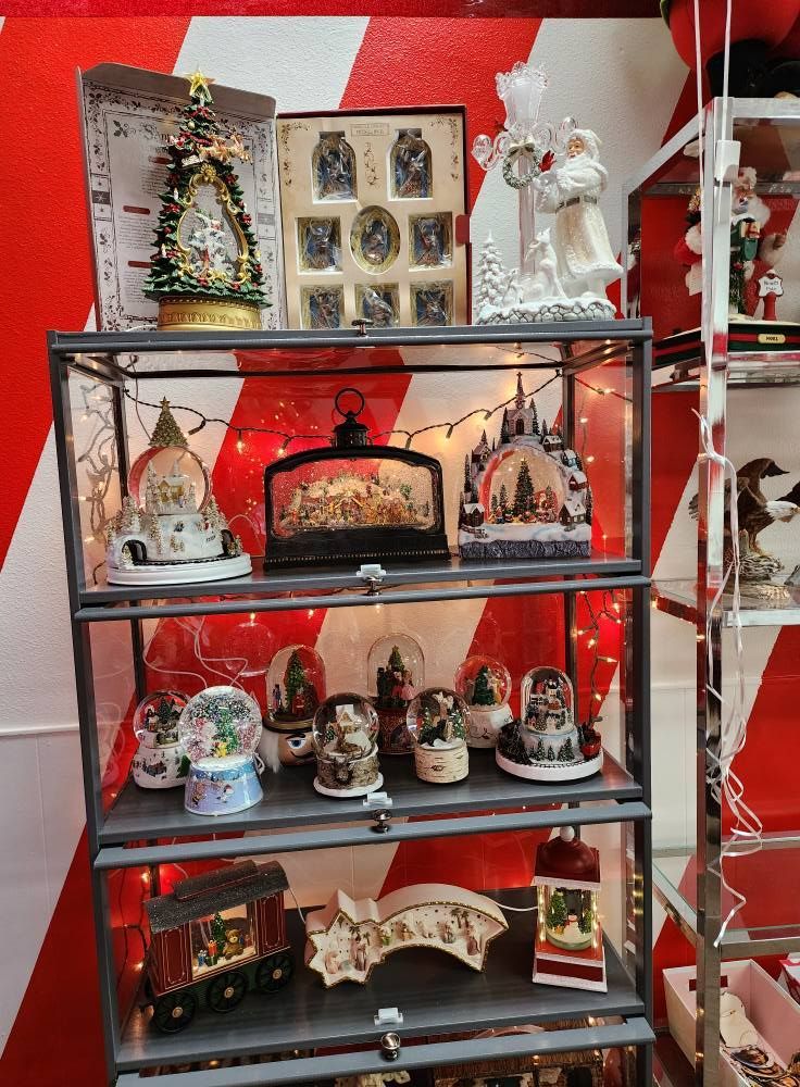 A display case filled with lots of christmas decorations