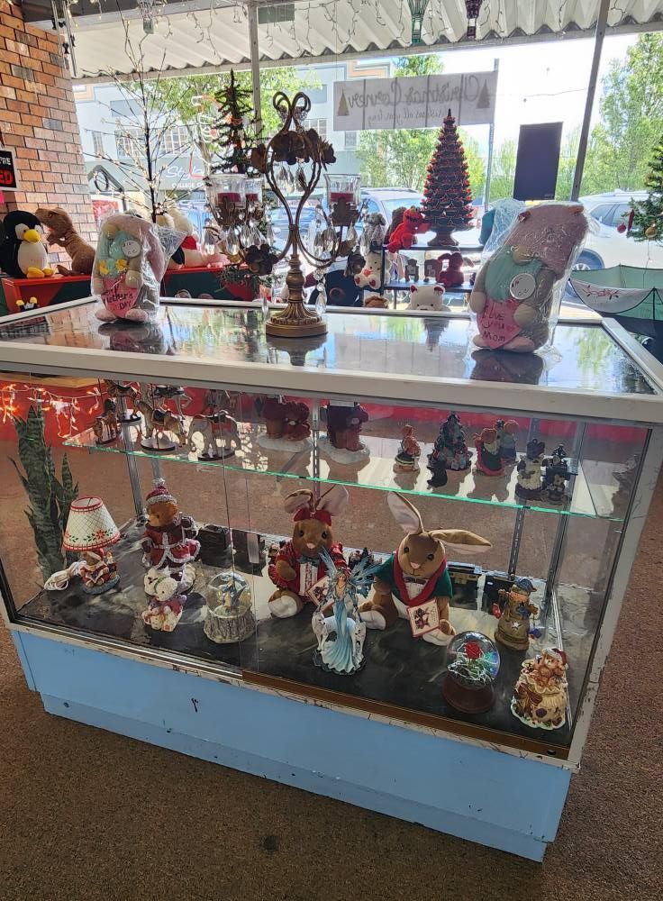 A display case filled with lots of christmas decorations in a store.