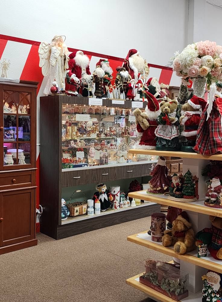 A display case filled with lots of christmas decorations in a store.