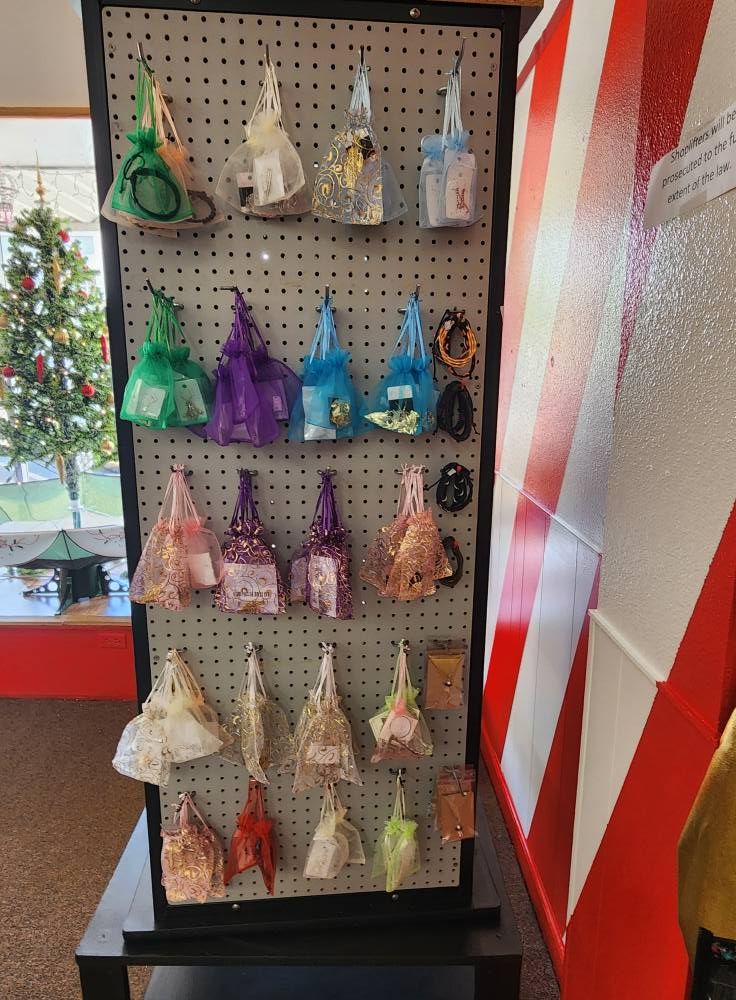 A peg board with a bunch of bags hanging on it