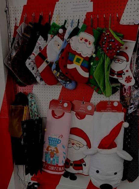 A bunch of christmas stockings hanging on a wall