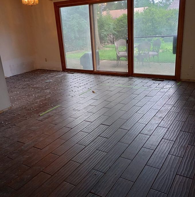 A hallway with a wooden floor and white walls