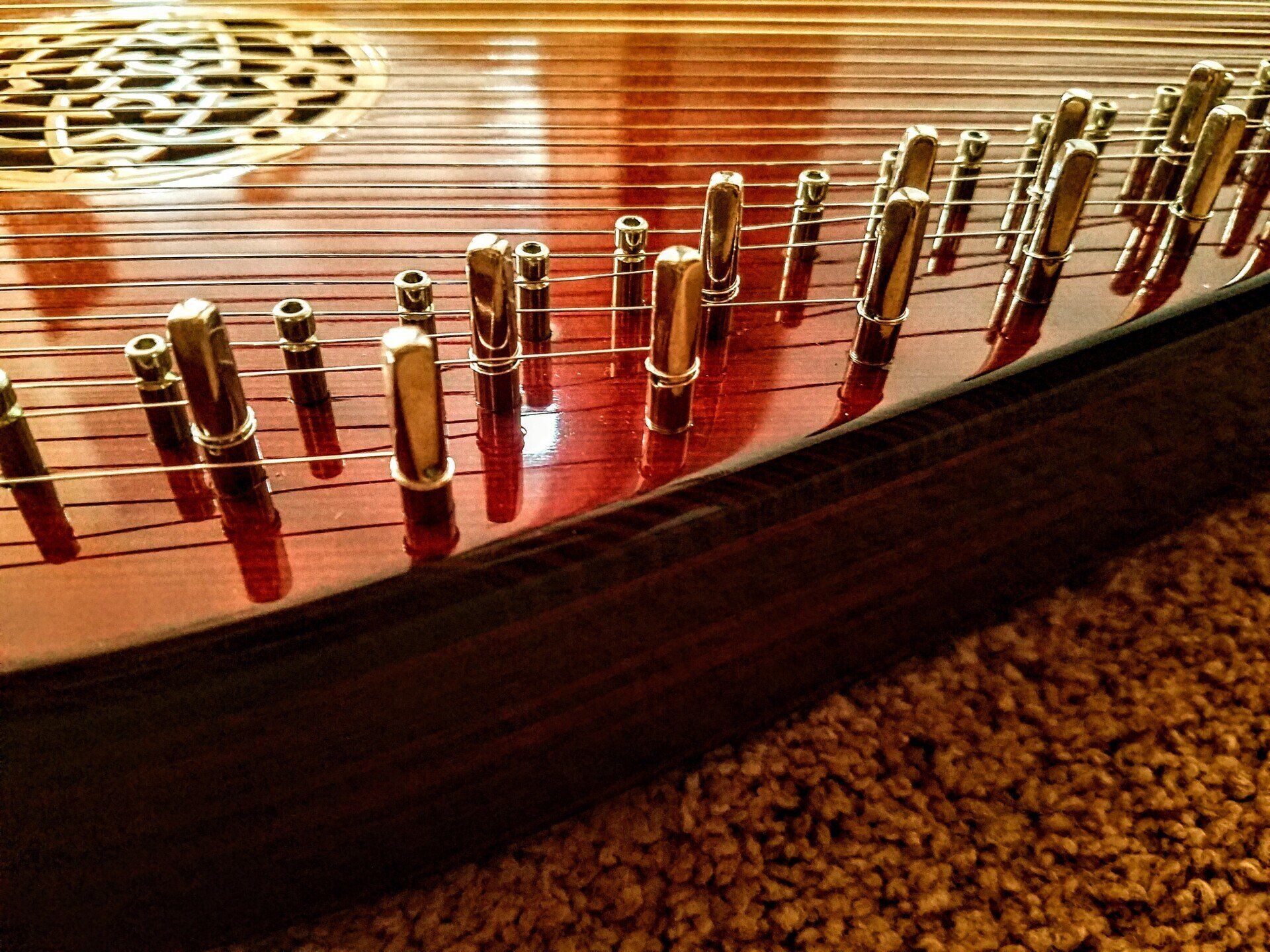 A close up of a harp on a carpet