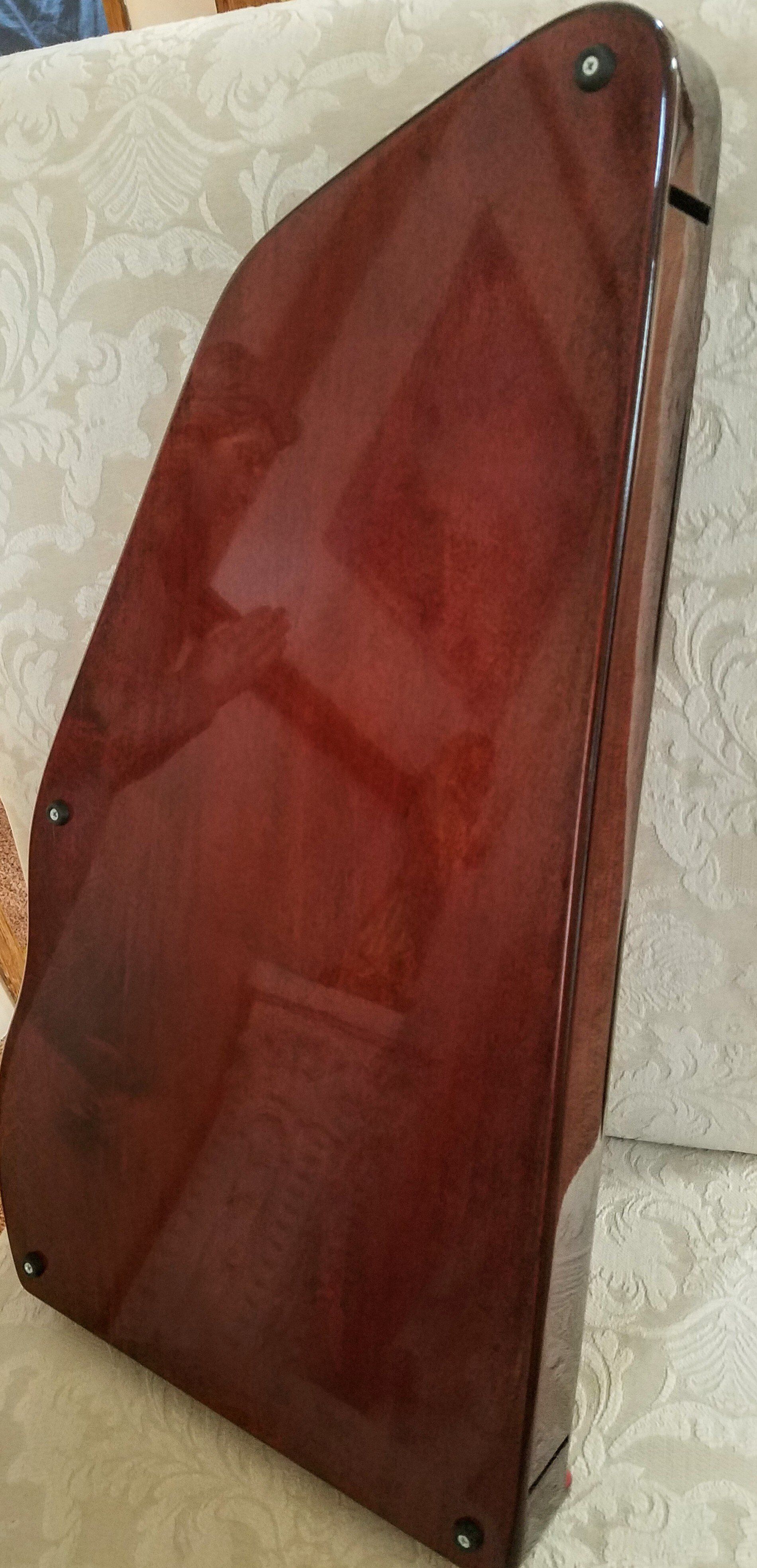 A wooden box is sitting on top of a couch.