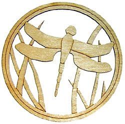 A wooden dragonfly is sitting on a branch in a circle.