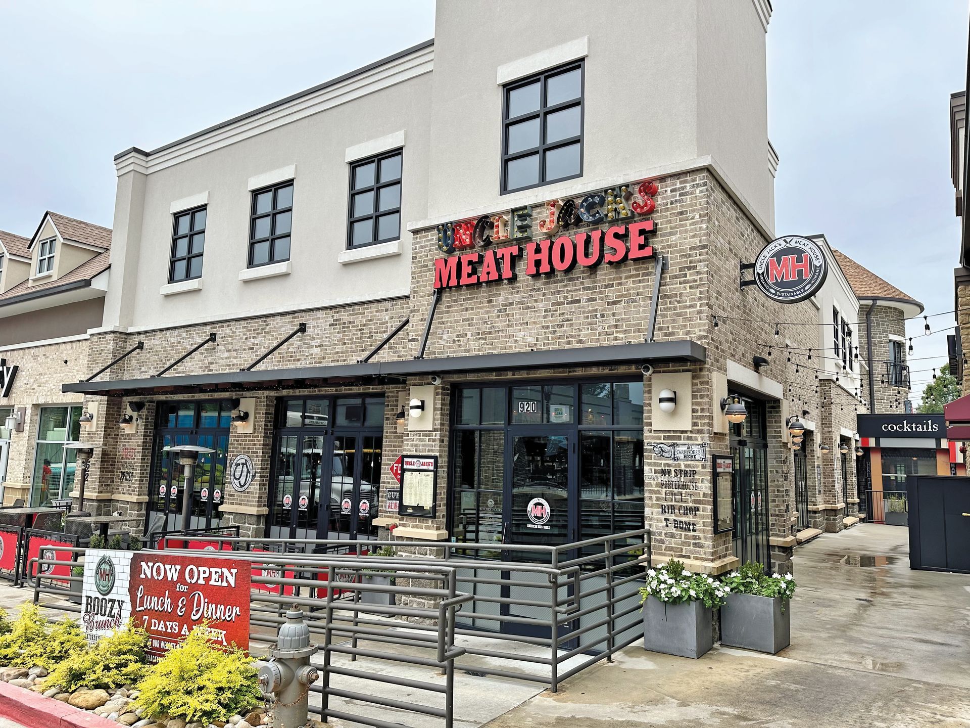 a brick building with a sign that says meat house