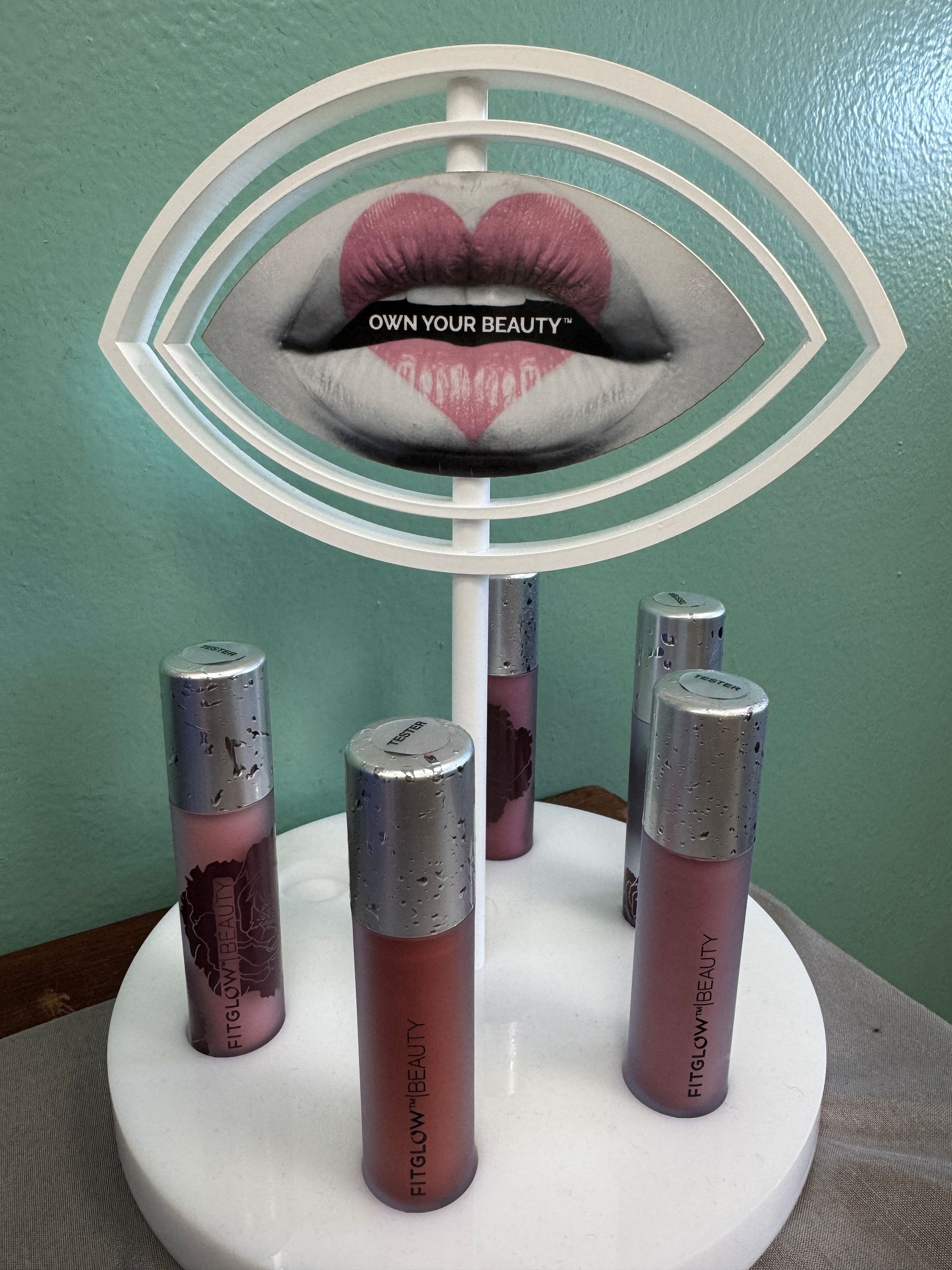 A display of lipsticks with a picture of a woman 's lips on it