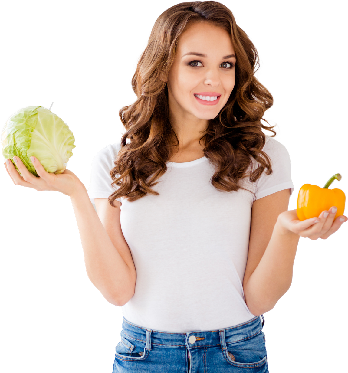 A woman is holding a pepper and a cabbage in her hands