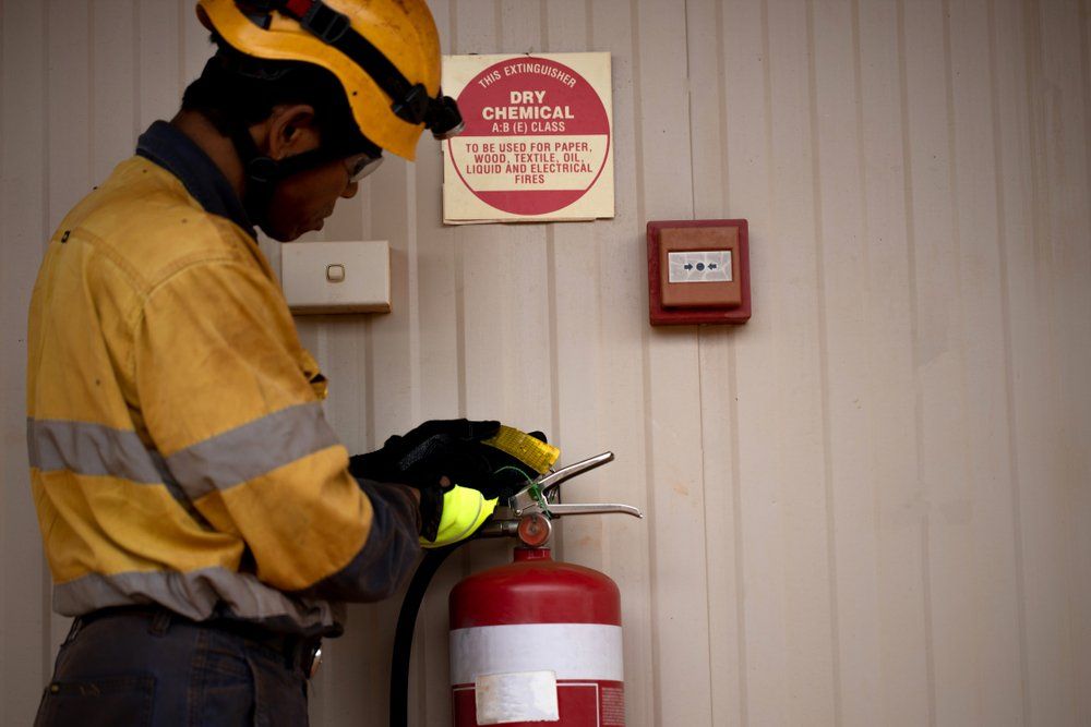 Inspecting Fire Extinguisher Tag — Fire Protection Services in Goonellabah, NSW