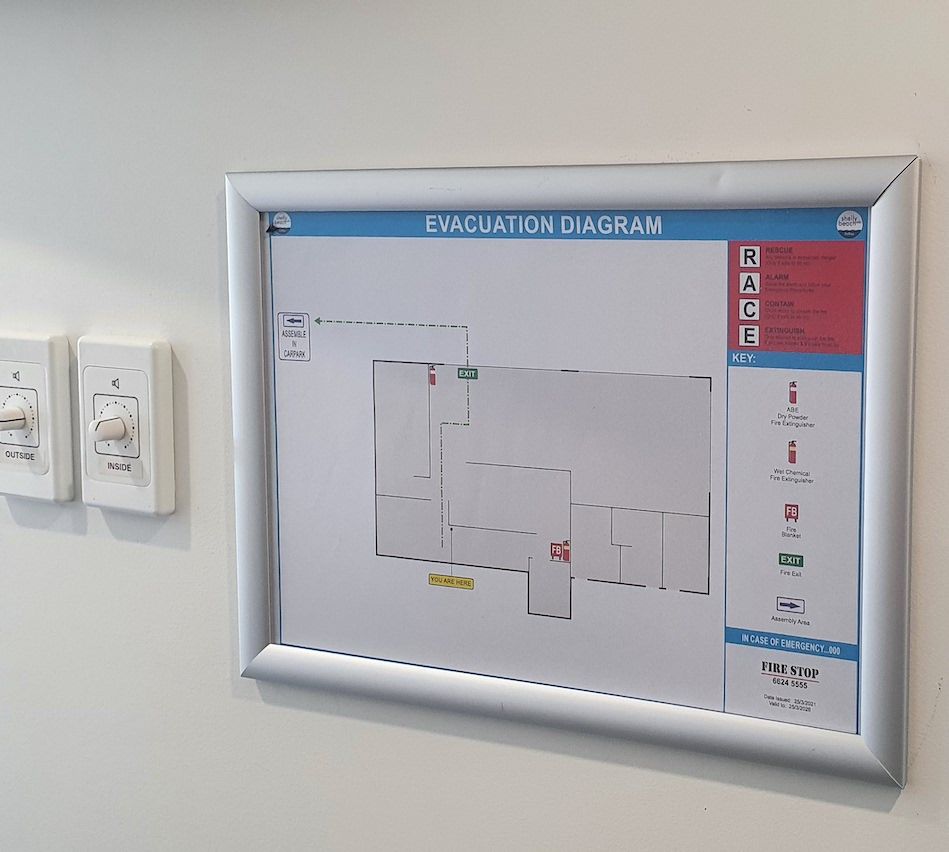 Emergency Fire Exit Green Sign — Fire Protection Services in Goonellabah, NSW