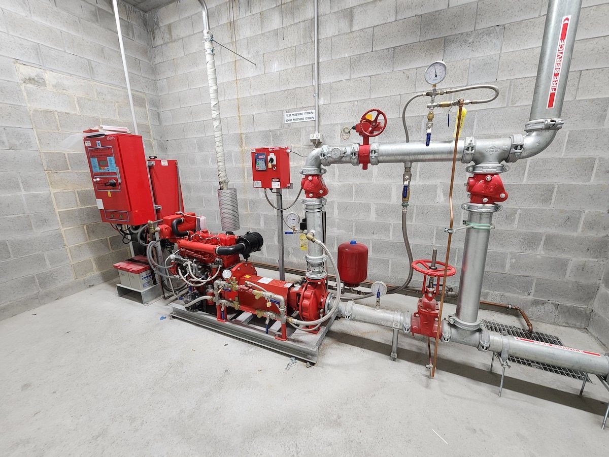 Handyman Installing Smoke Detector — Fire Protection Services in Goonellabah, NSW