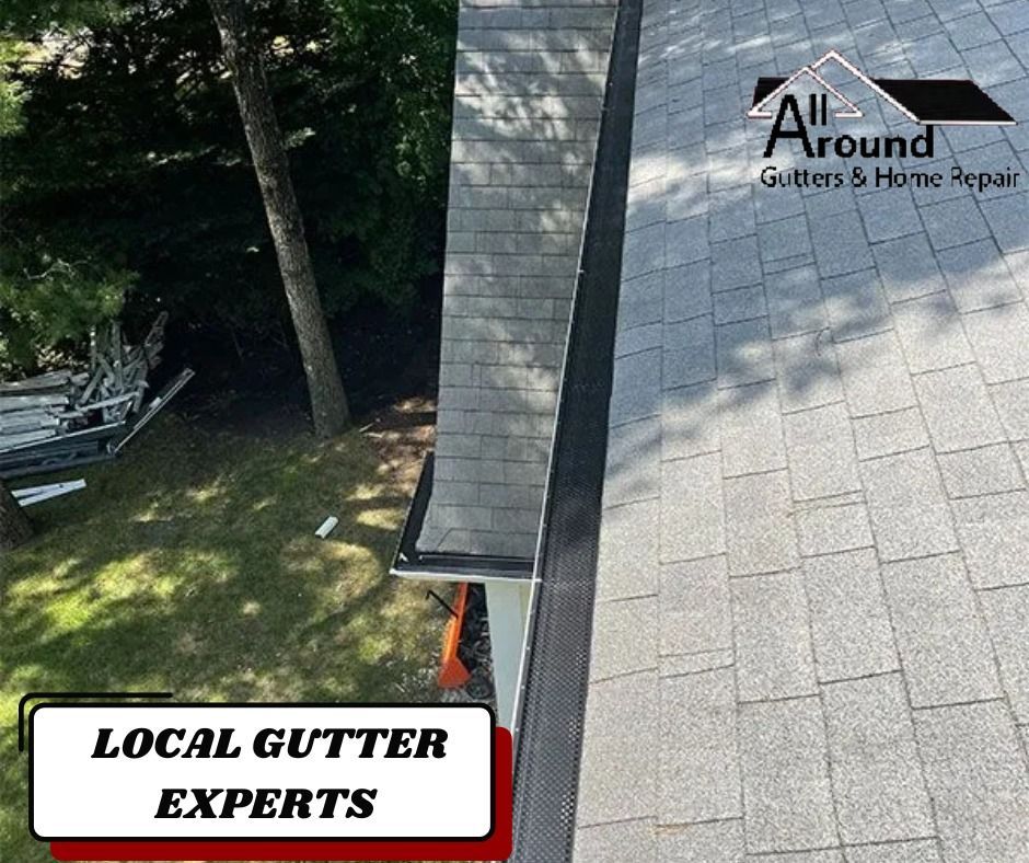 An aerial view of a house with gutters and a sign that says local gutter experts.