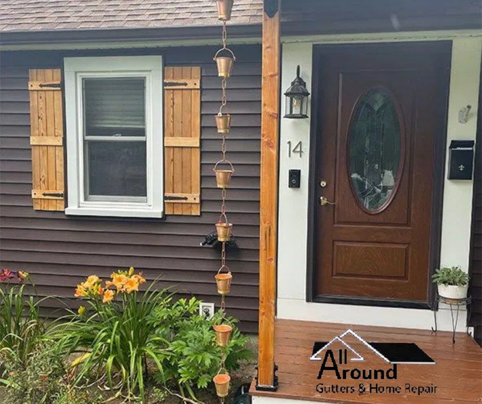 A house with a porch and a rain chain on it