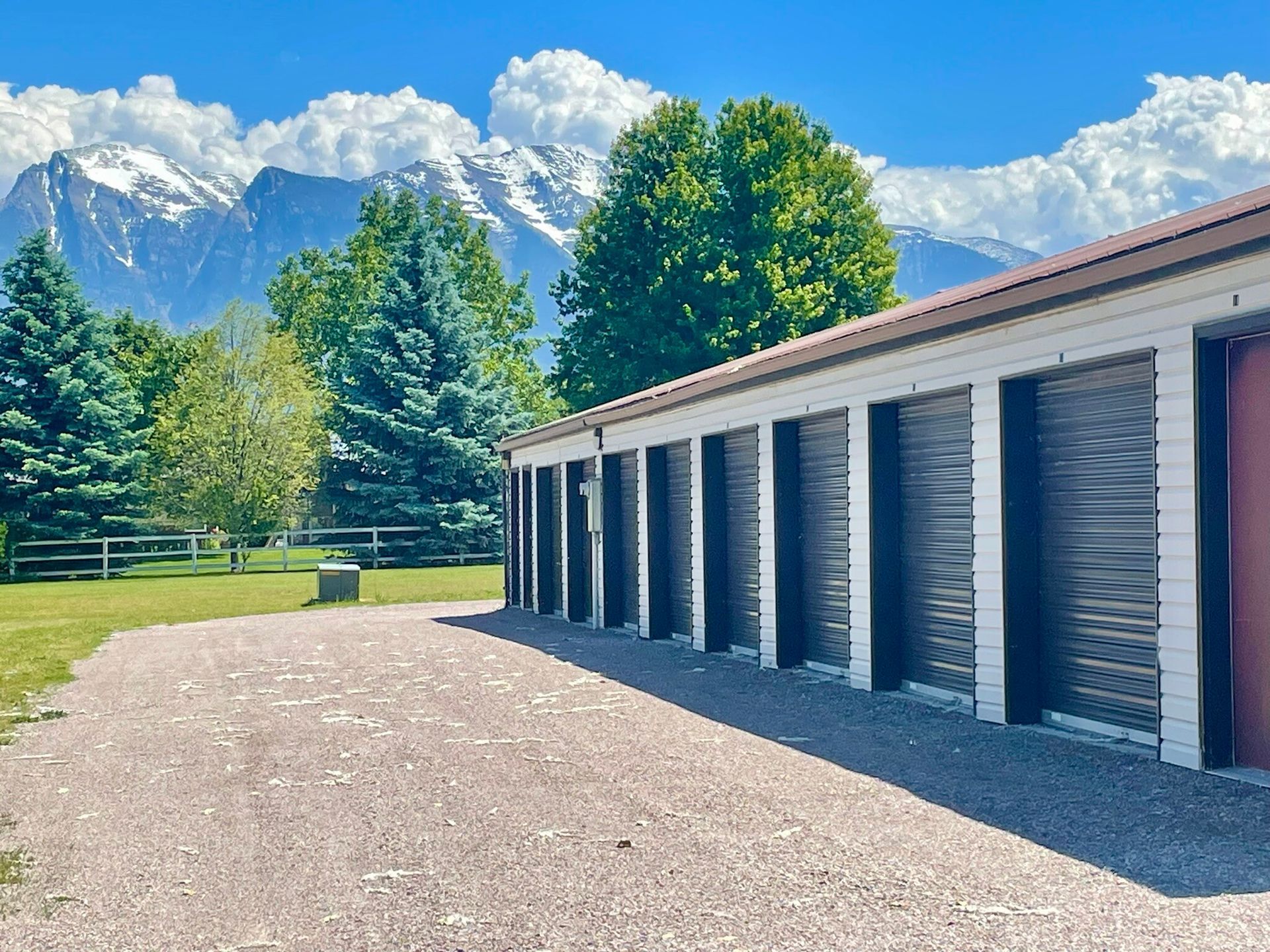 A row of storage units with mountains in the background