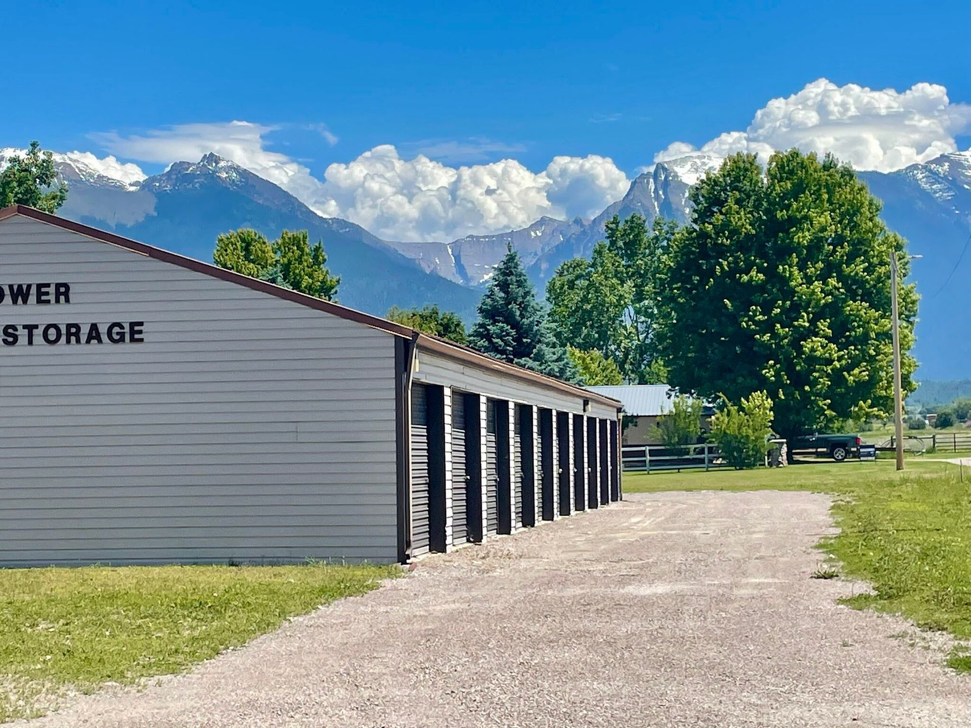 A row of storage units with mountains in the background