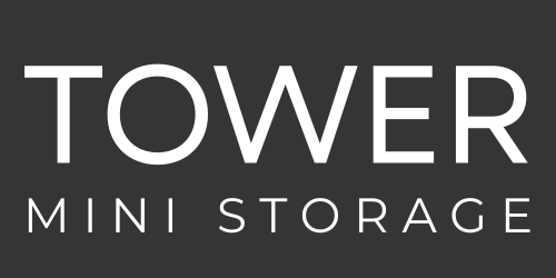 The logo for tower mini storage is white on a black background.