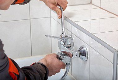 Plumber Fixing Water Tap — Plumbing Solution in Orange, NSW