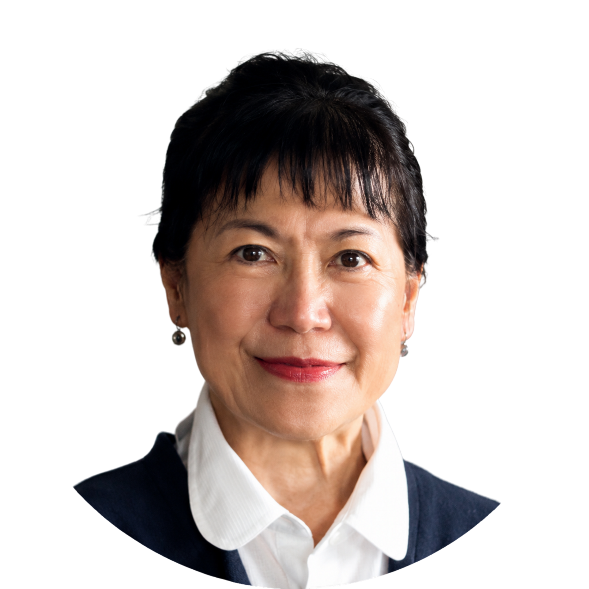 Portrait of a woman in a white collared shirt and dark blazer, smiling against a white background