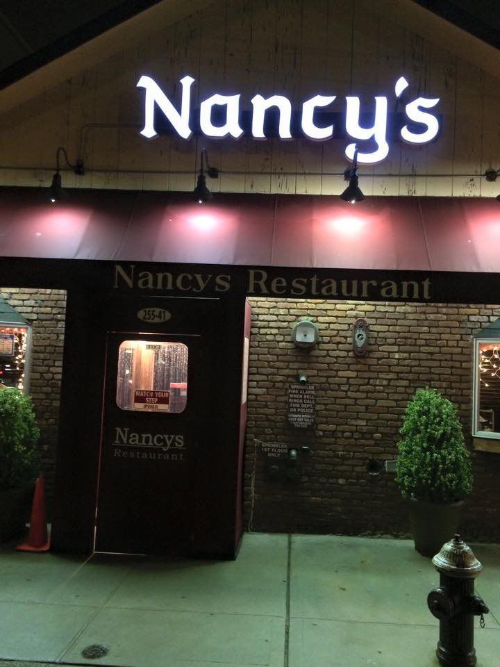 Nancy 's restaurant with a fire hydrant in front of it