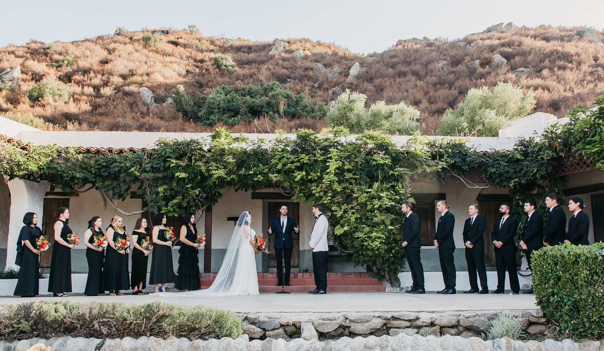 Photo of a wedding held on the steps of the Hacienda at the Ramona Bowl Amphitheatre