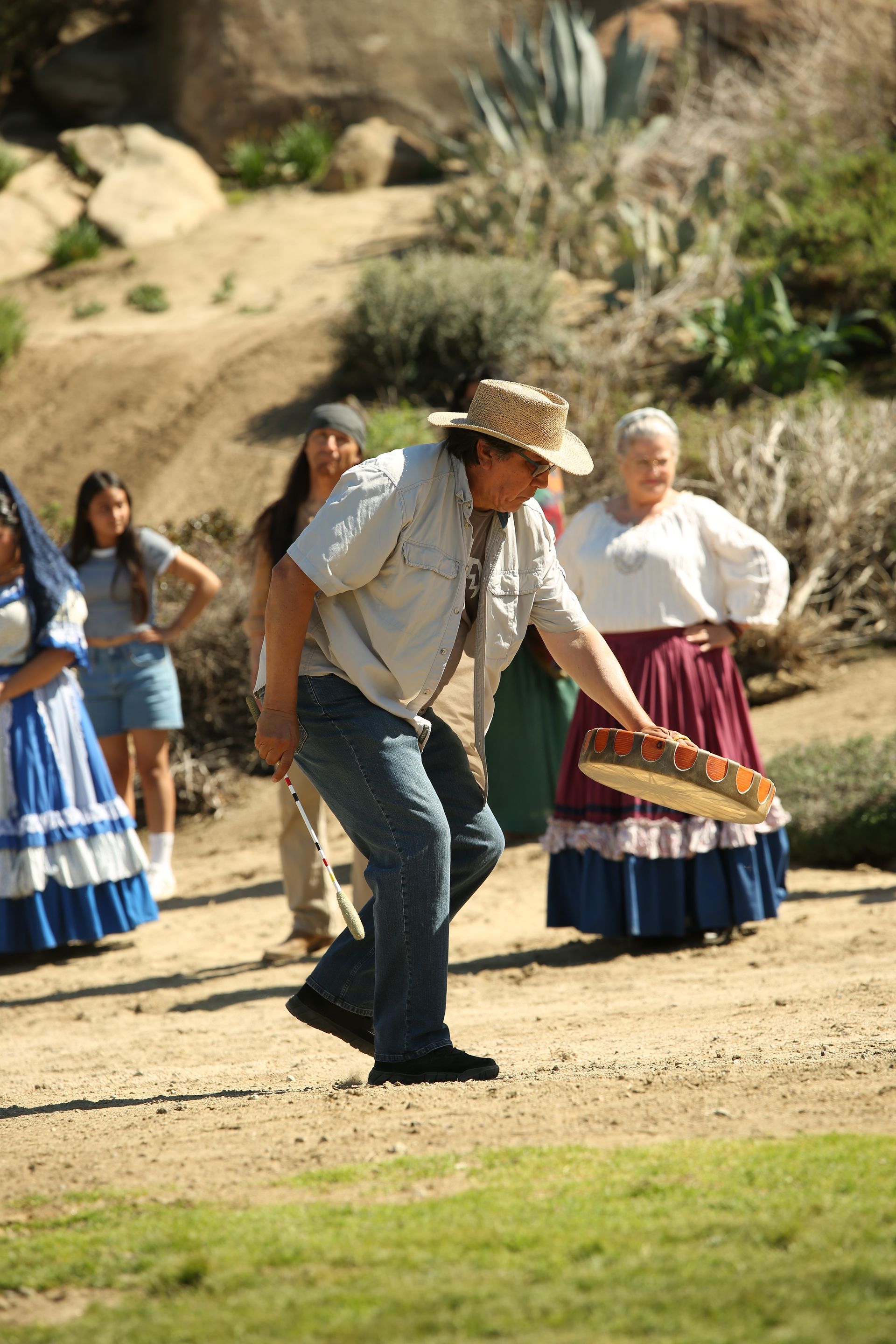 Photo of Duane Minard dancing and singing during Elder Blessing Scene practice for Ramona