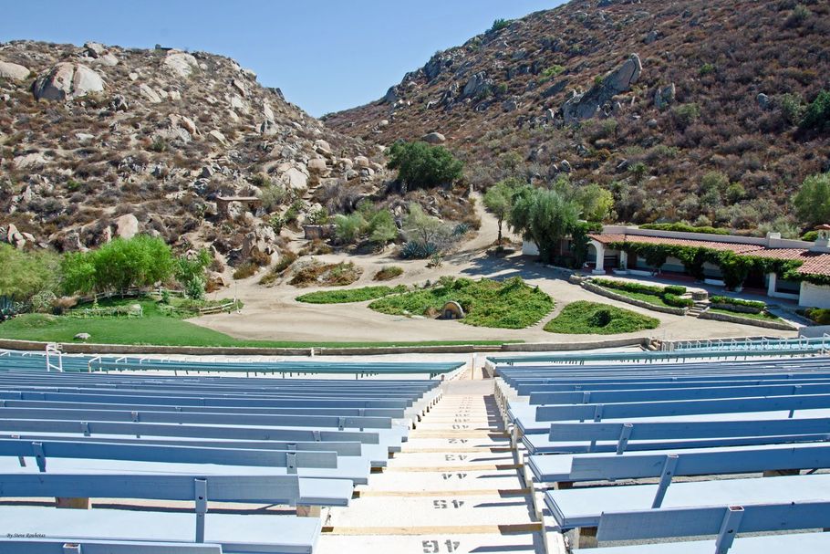 Photo of the Ramona Bowl Amphitheatre from the top of the stands looking down onto the natural stage and Hacienda from set of 