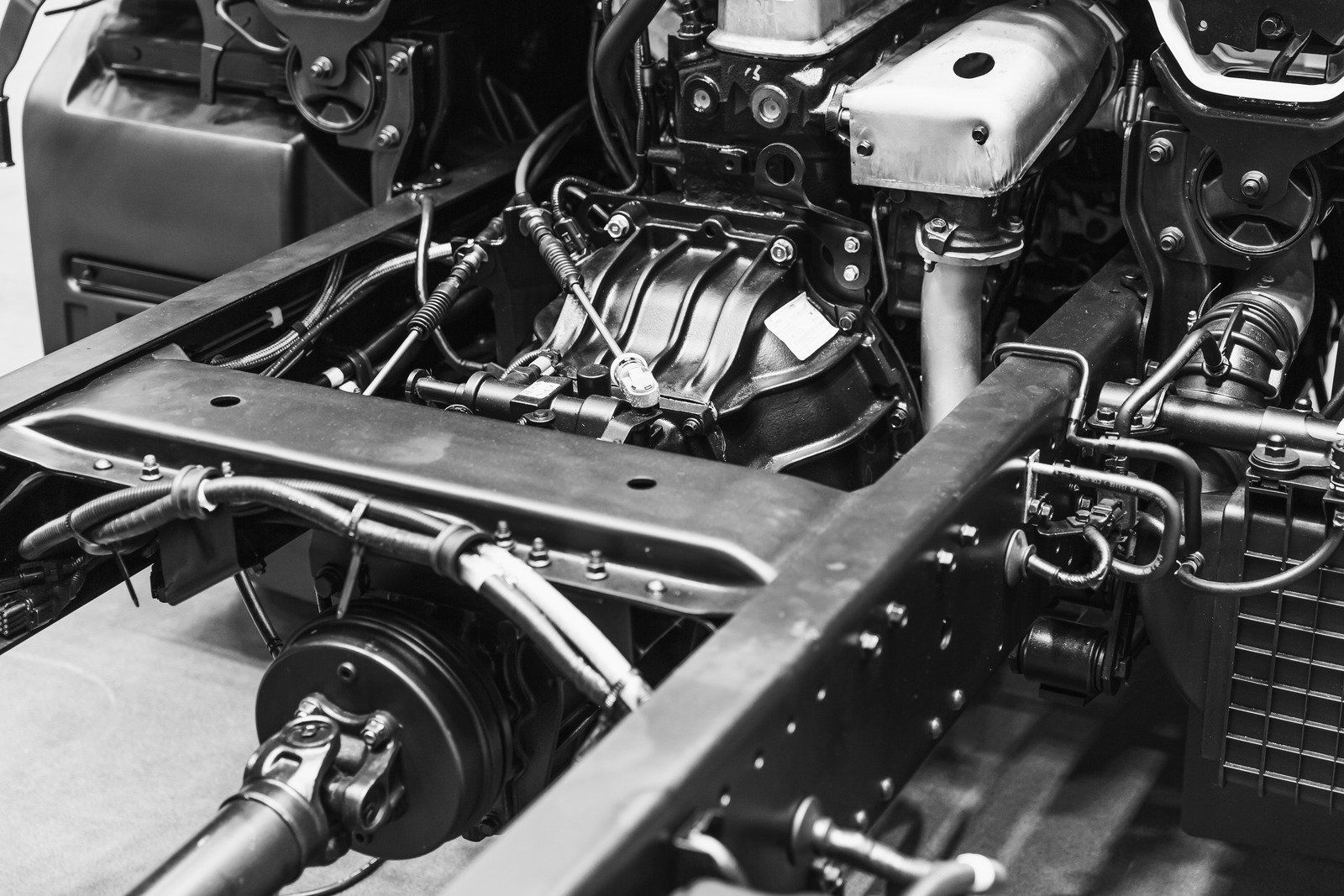 A black and white photo of a truck engine