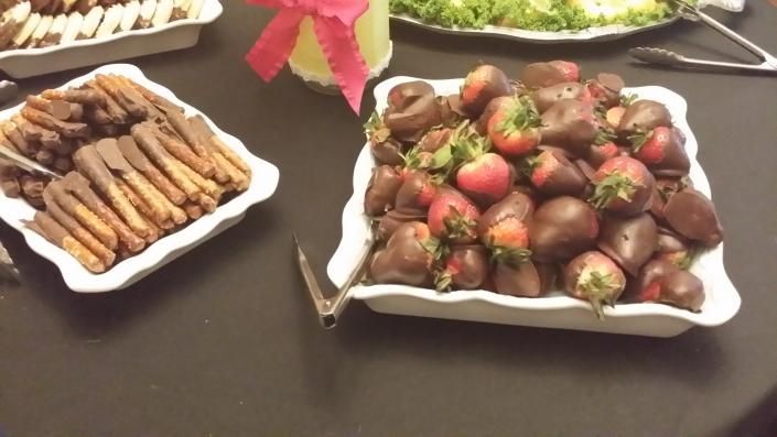 chocolate covered strawberries and pretzel sticks