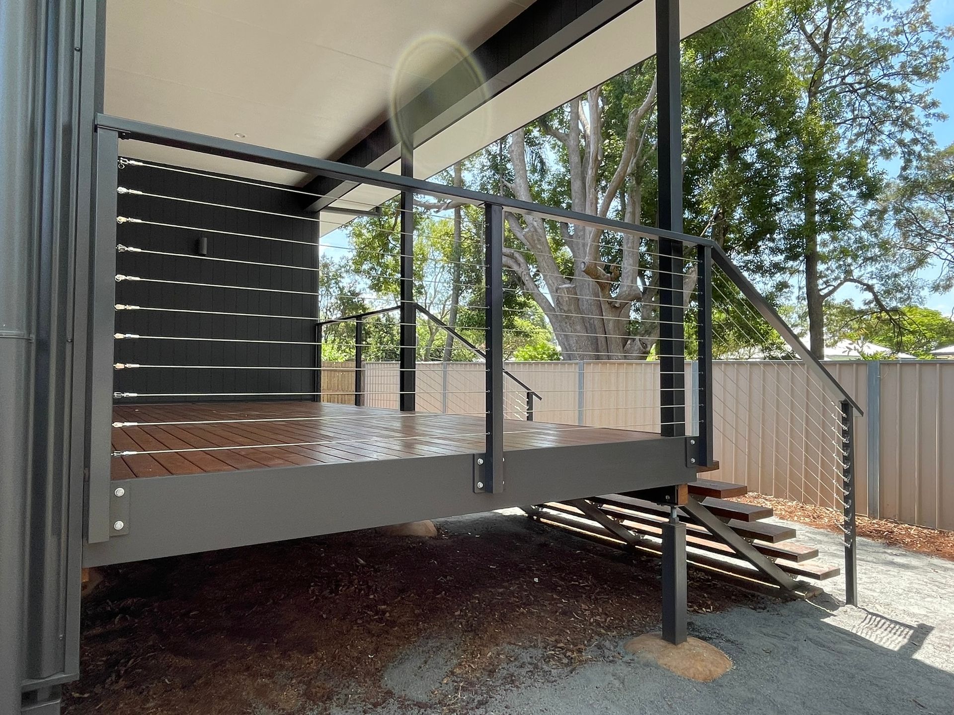 A large deck with stairs leading up to it