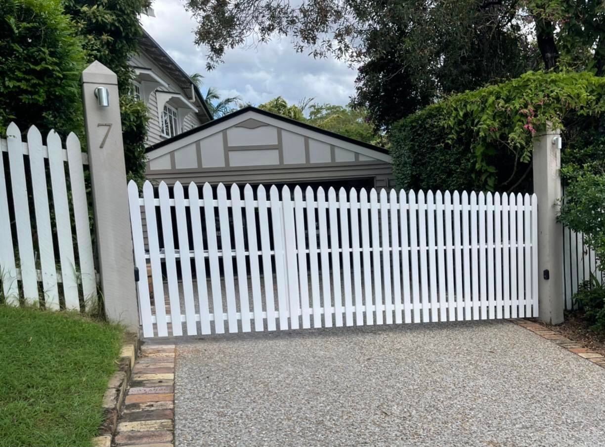 A wooden fence is sitting in front of a building