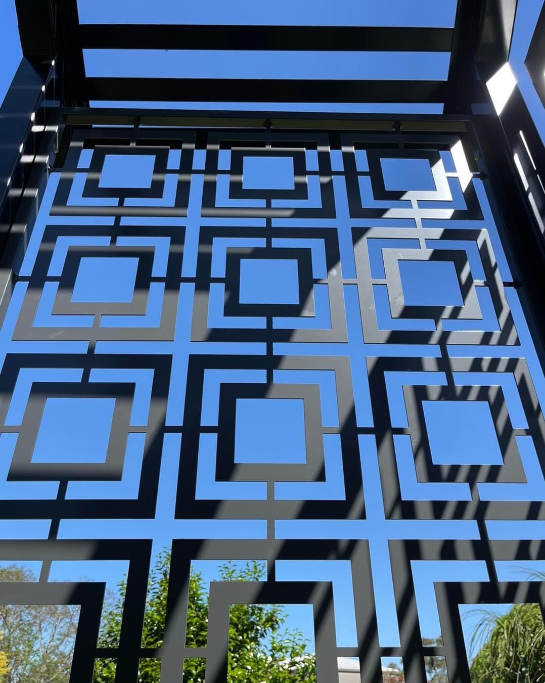 Looking up at a gate with a blue sky in the background