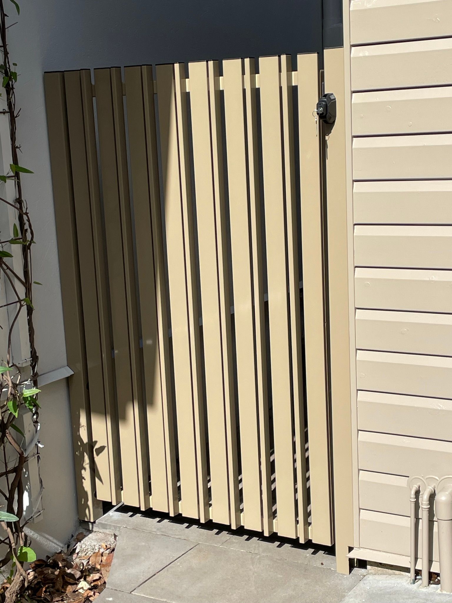 A wooden fence is sitting in front of a building