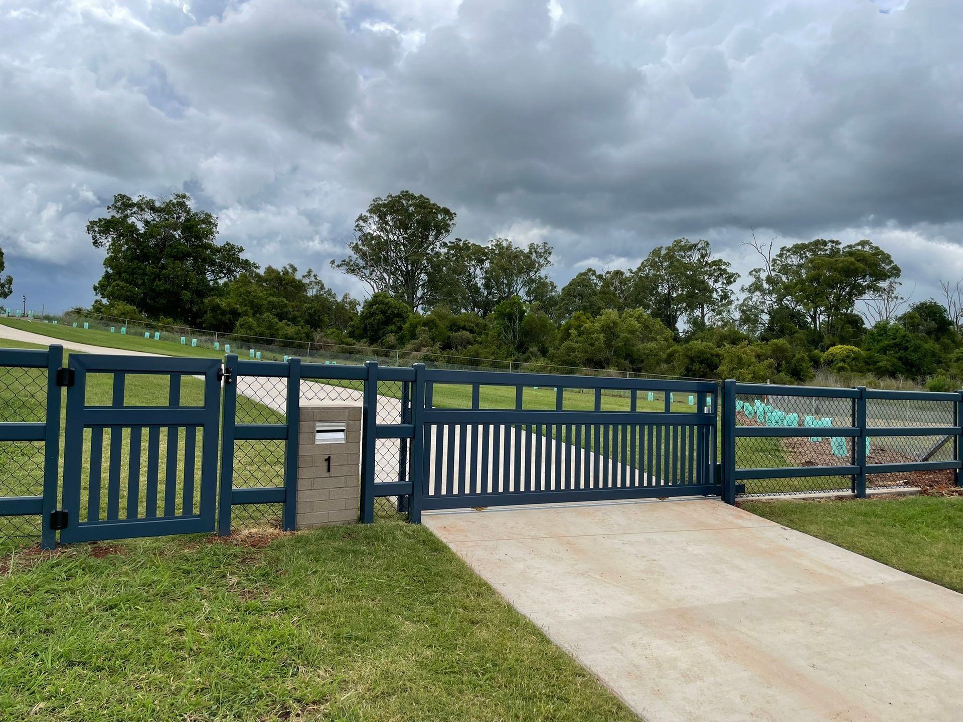 A blue fence with the number 1 on it