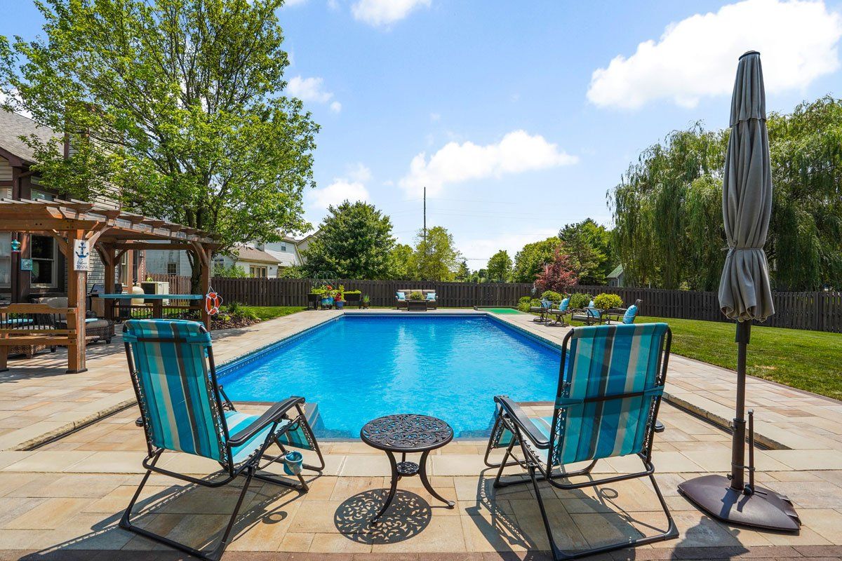 In-Ground Swimming Pool, Patio and Landscaping Installation