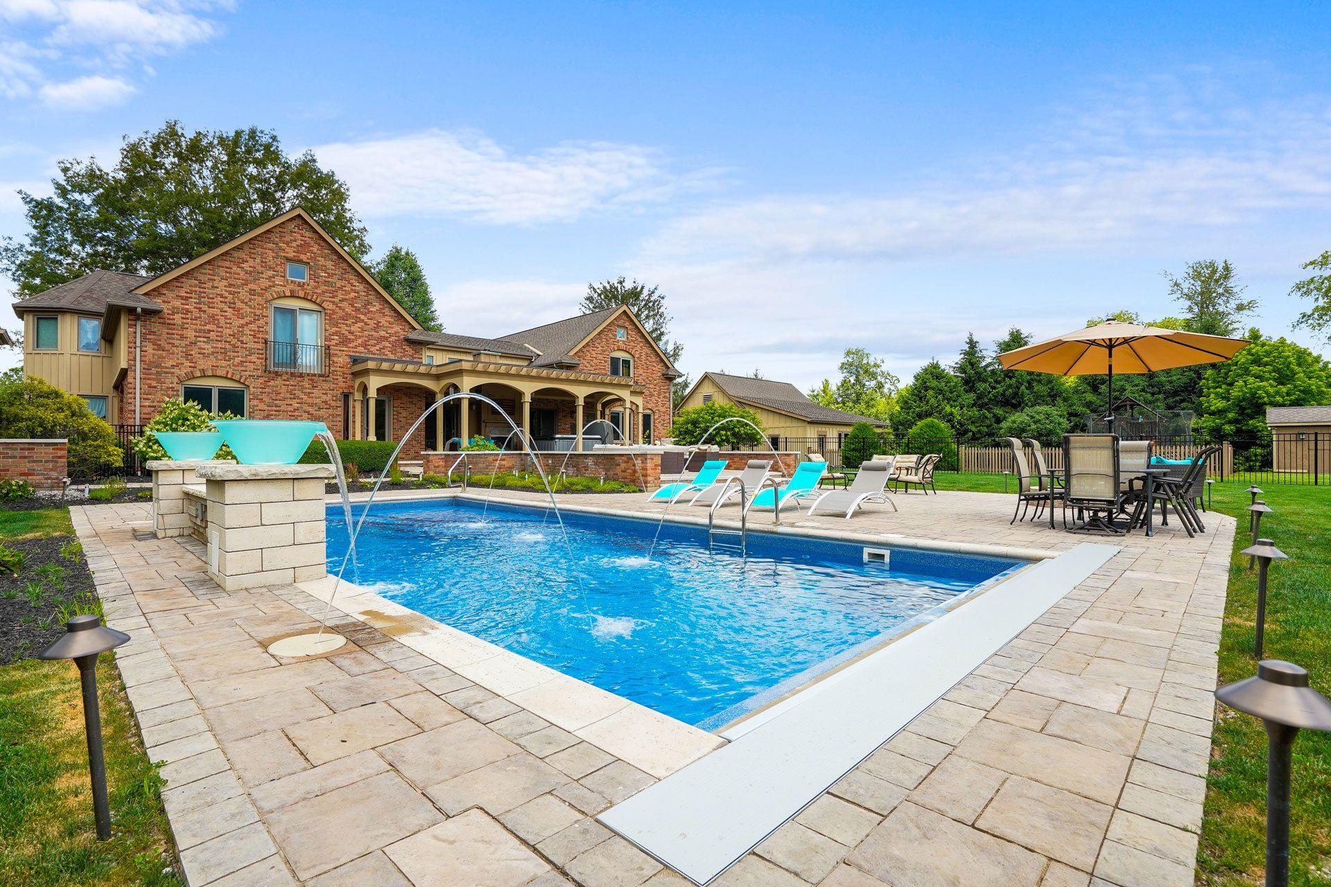 In-Ground Swimming Pool, Patio and Landscaping Installation