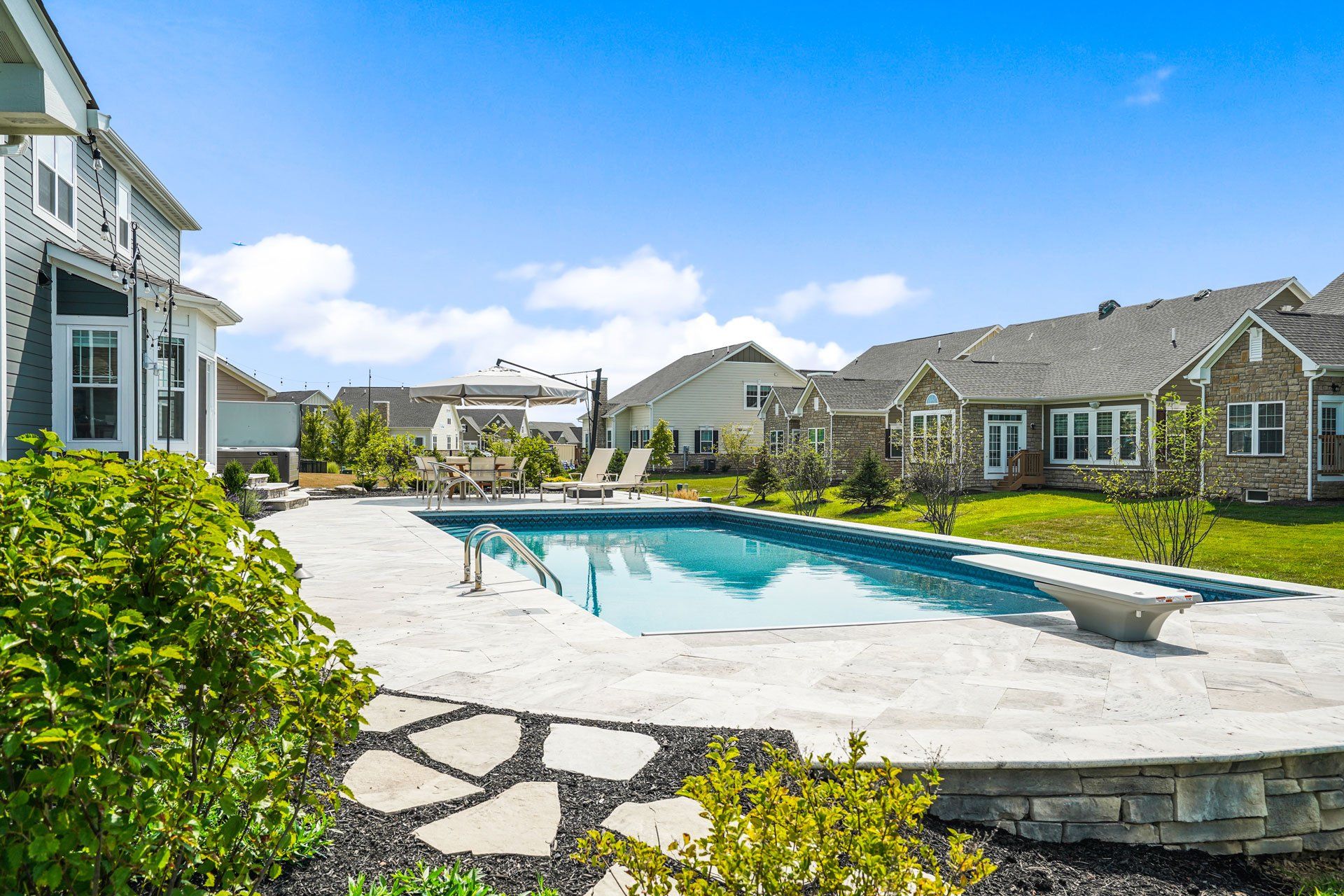 In-Ground Swimming Pool, Patio and Landscaping Installation