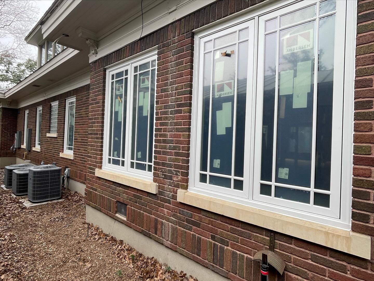 A brick building with a lot of windows on it.