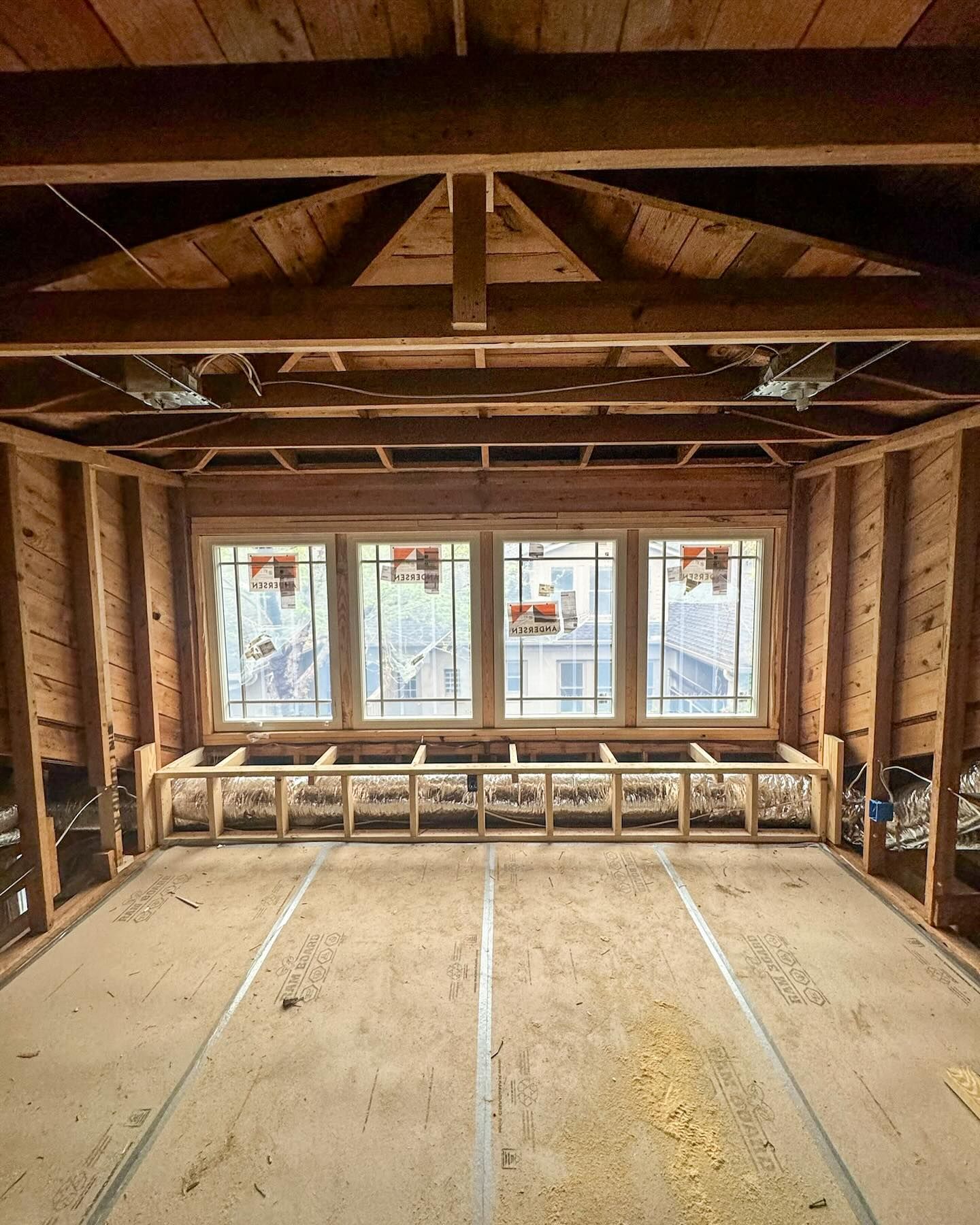 The inside of a building under construction with a lot of windows