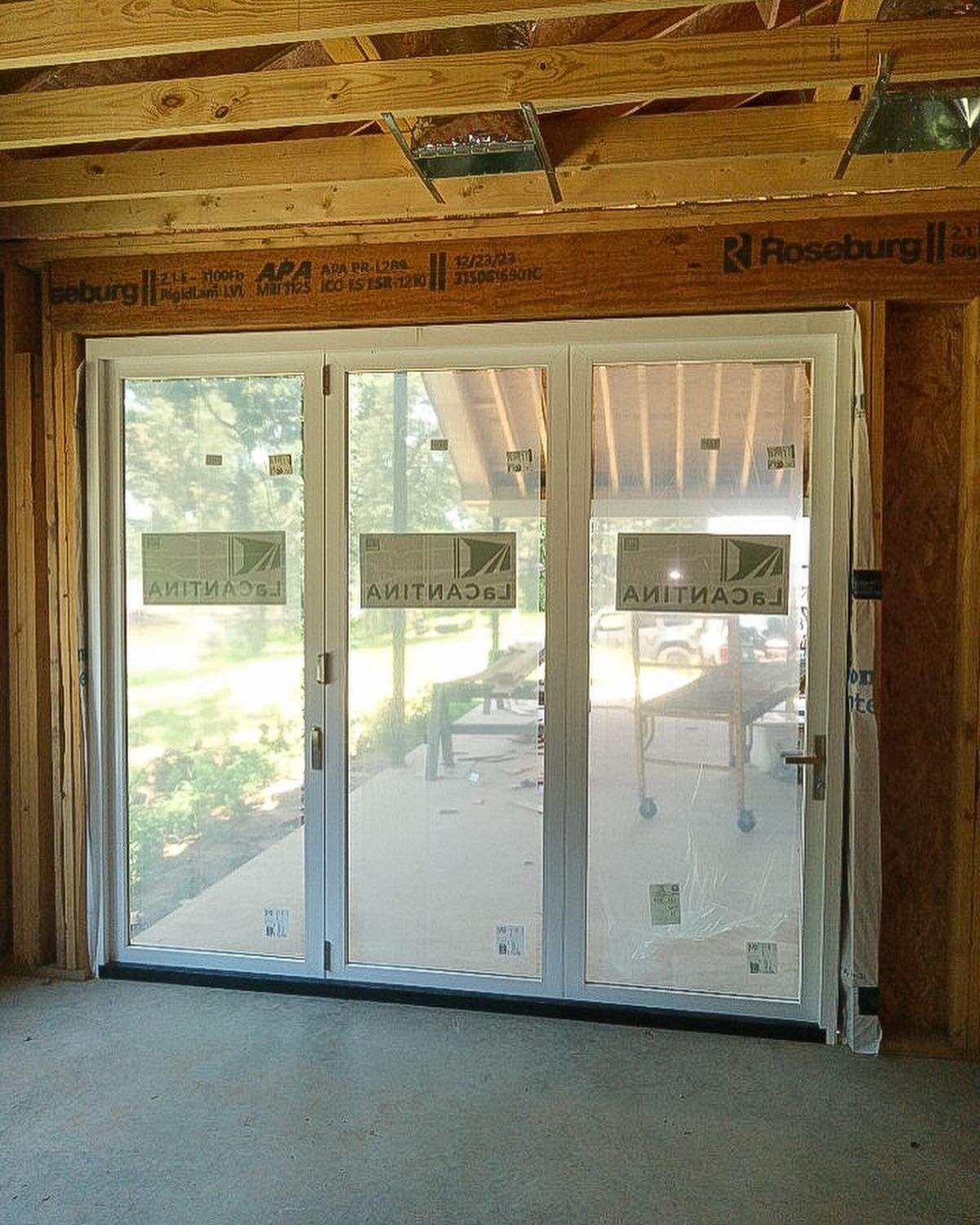 A room with a sliding glass door and a sign that says ' sliding glass door ' on it