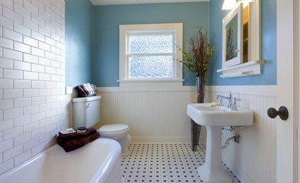smart new blue and white bathroom with black and white victorian checked floor tiles