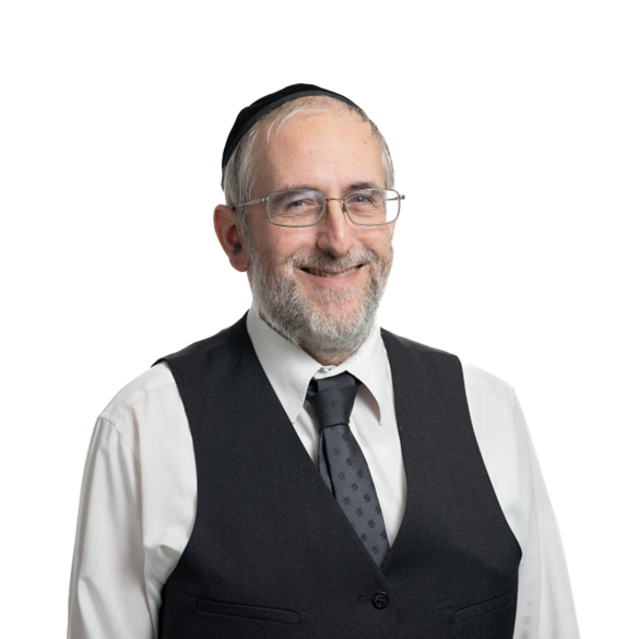 Man with glasses and yarmulke smiles, wearing a tie, waistcoat, and white shirt.
