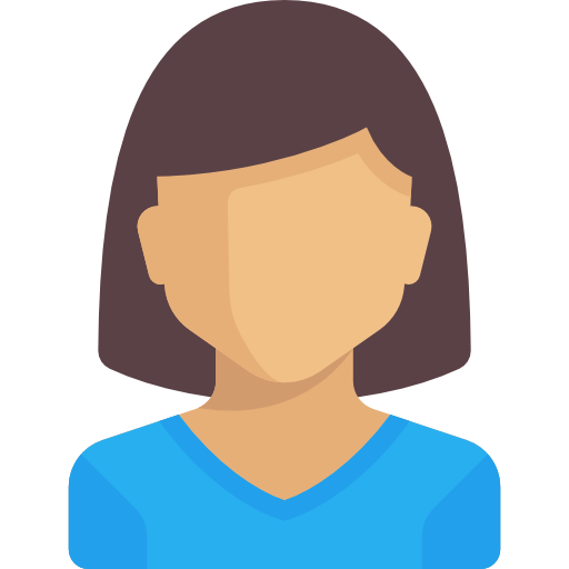 A person with shoulder-length hair smiles in a head-and-shoulders portrait, wearing a black top against a gray background.