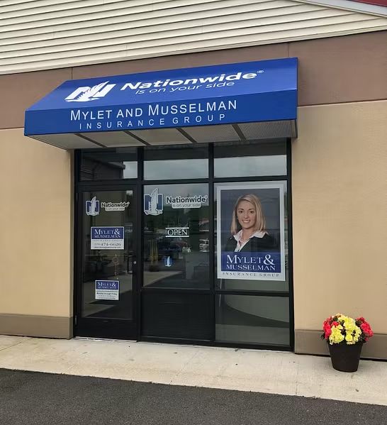 Group of people outside a law office; the sign reads 