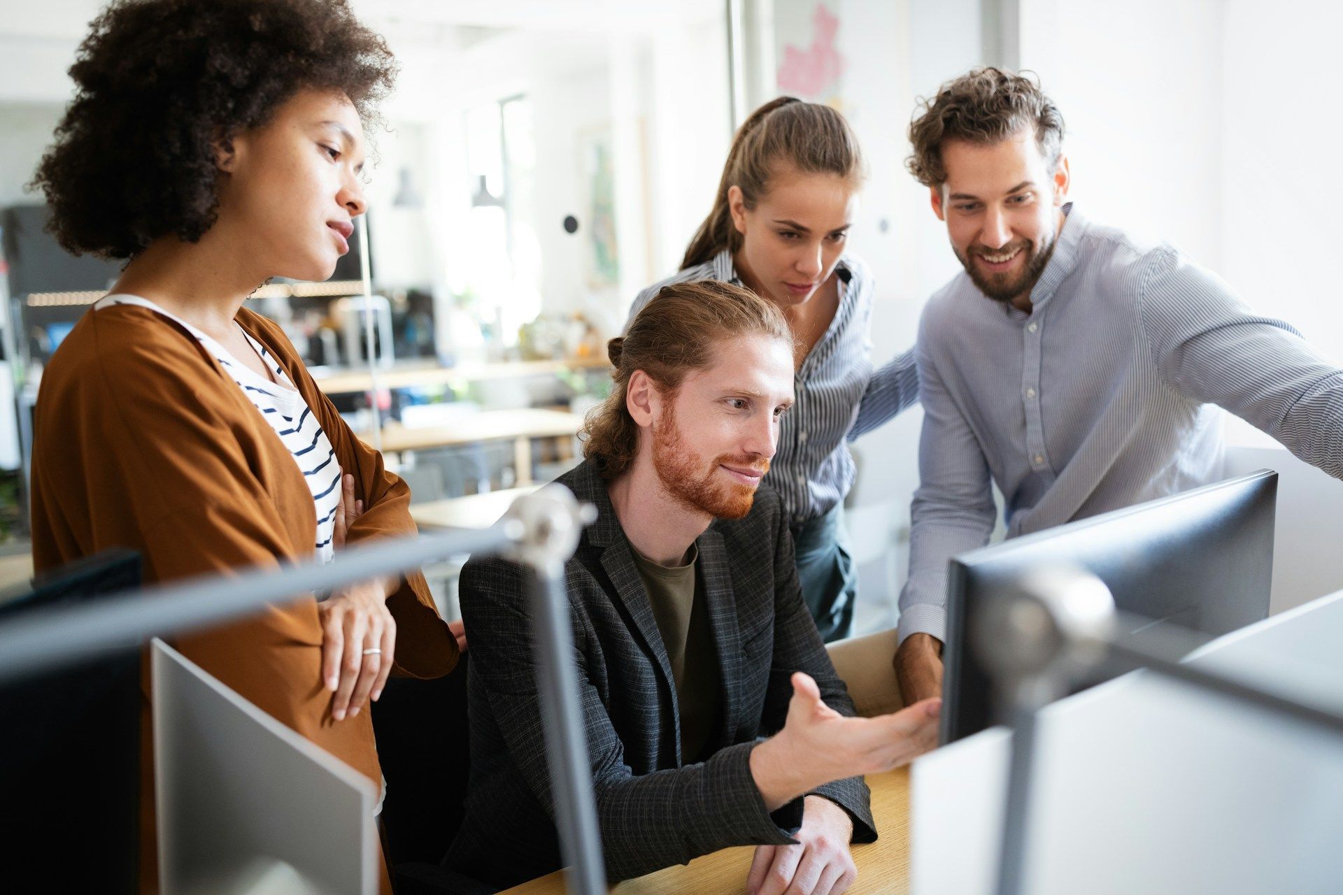 Person holding scales of justice, gavel on table, legal setting.