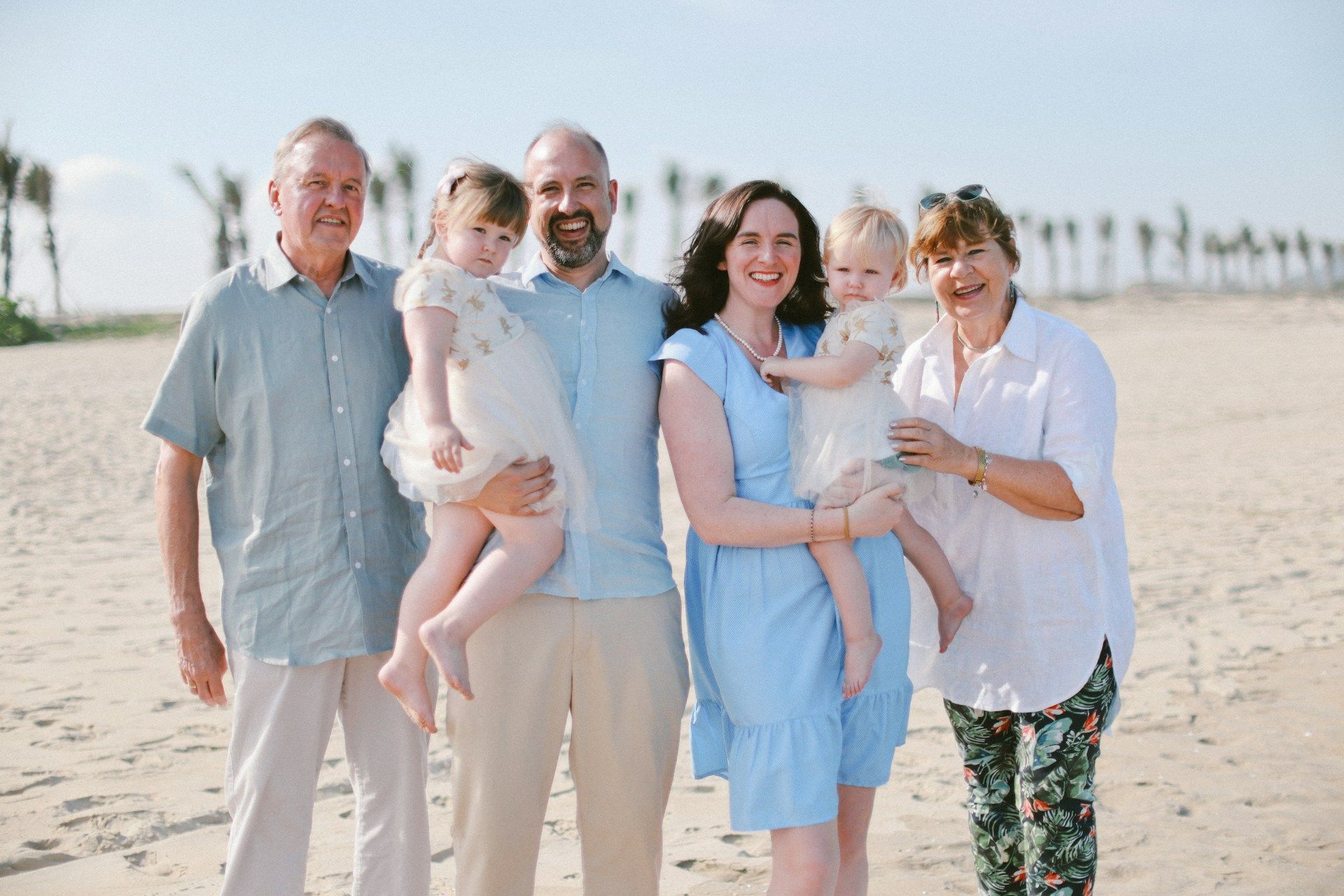 Person holding scales of justice, gavel on table, legal setting.