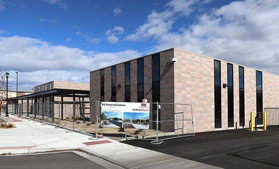 A large building with a lot of windows is under construction.