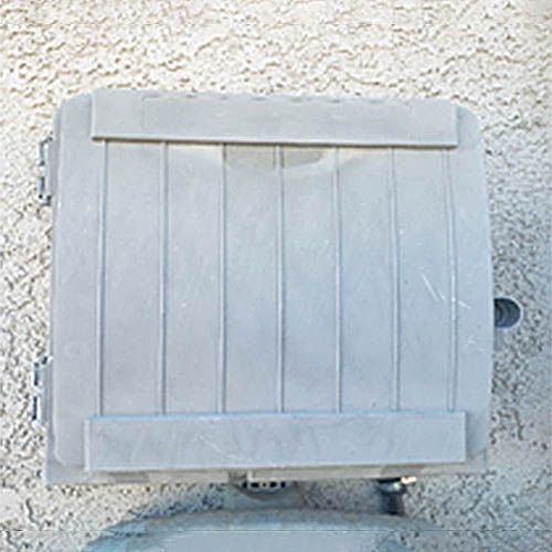 A gray plastic box with a wooden lid is sitting on top of a concrete surface.