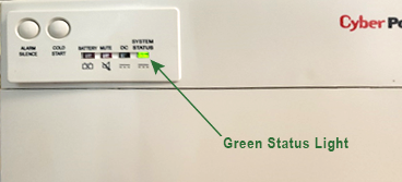 A dishwasher with a green status light on it